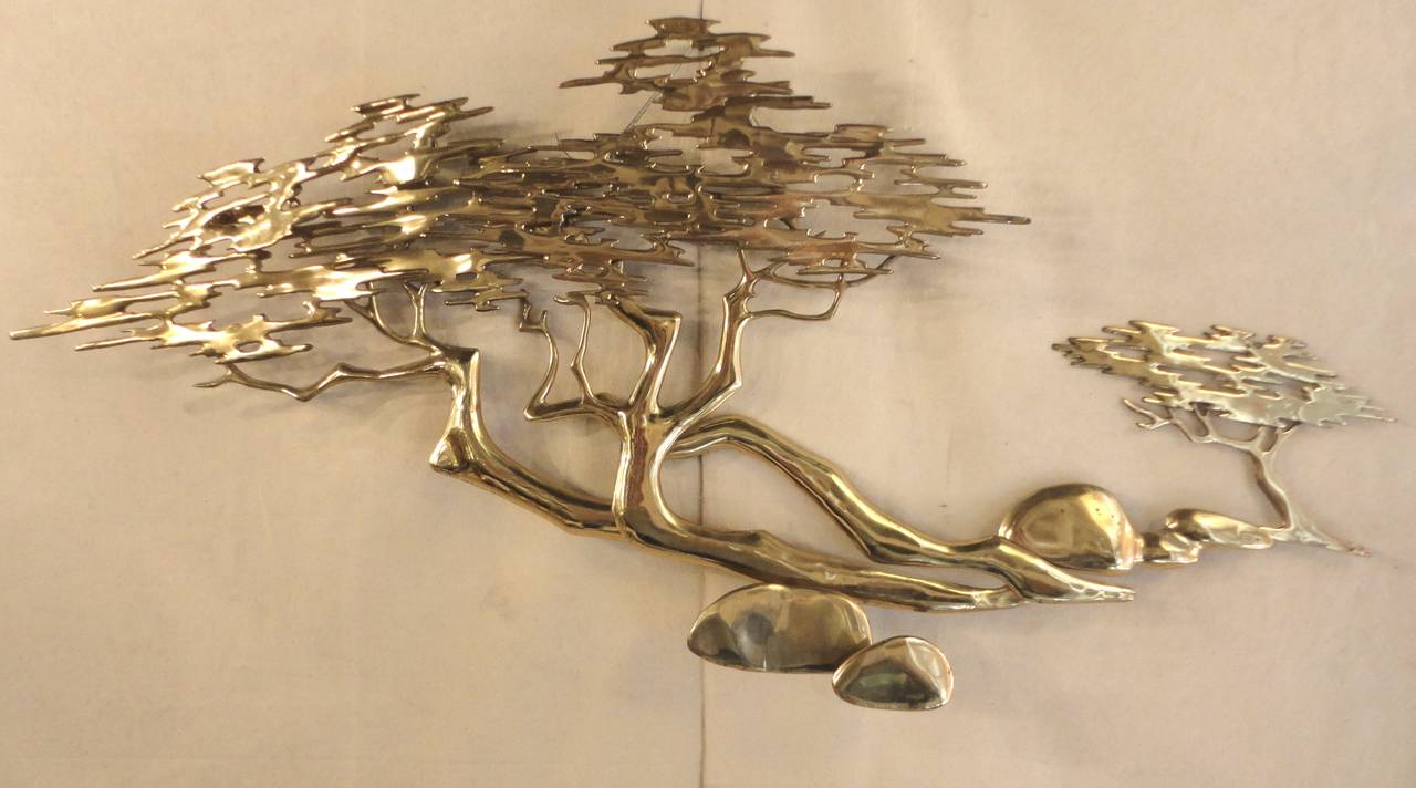 Lovely artistic depiction of a Bonsai tree and rocks done in a polished brass. Art is signed and dated.

(Please confirm item location - NY or NJ - with dealer)
