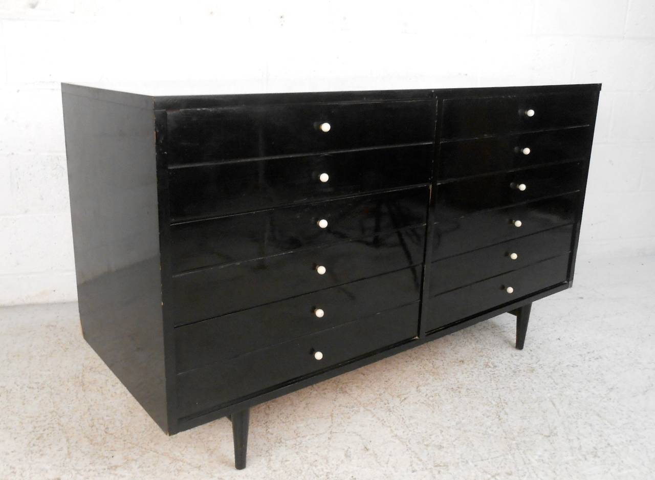 This beautiful Martinsville dresser features unique McCobb style drawer pulls, black lacquer finish, white formica style top, and plenty of storage for any room! Please confirm item location (NY or NJ).