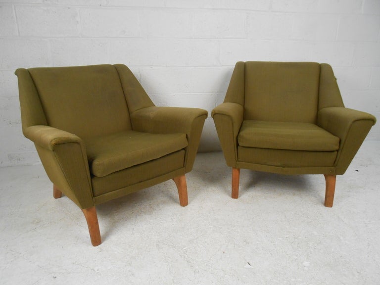 These classic vintage Danish lounge chairs are ready for re-upholstery and make a beautiful addition to any room. Scandinavian Modern construction makes an impressive addition to home or business seating area. Seat cushions not included. 

