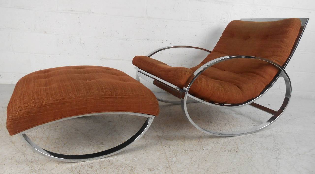 This stylish Italian rocker features the Mid-Century design of Renato Zevi, comfortable tufted fabric paired with modern style chrome frame make this unique chair a wonderful addition to any room. Please confirm item location (NY or NJ).