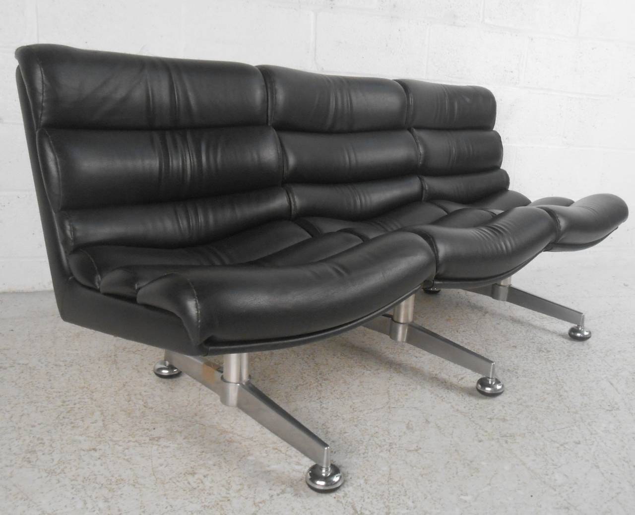 This unique three seat sofa is both wonderfully designed and well upholstered. Quality chrome base and unique construction make this the perfect seating solution for home or business. Please confirm item location (NY or NJ).