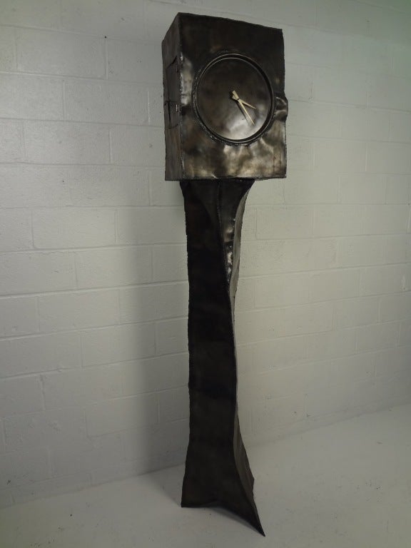 Artistically crafted floor clock constructed in metal with exposed welds. Styled like it is taken from a Tim Burton film, this is not your grandfather's clock! A true eye catching piece.
Please confirm location NY or NJ