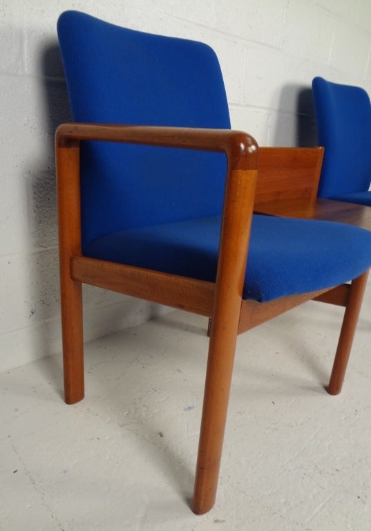 Deep reddish wood tones contrast nicely with the saturated blue fabric upholstery, enhancing the overall design. Please confirm item location (NY or NJ) with dealer.