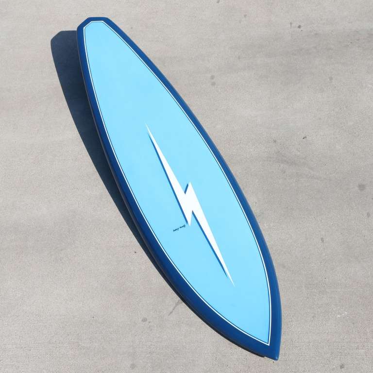 This is a fully restored 1970's Gerry Lopez, Lightning Bolt Surfboard.
The sky blue and royal blue color combo is fresh and vibrant.
Featuring a diamond shape tail - a Lopez invention.  This was the style board that Gerry Lopez rode during this