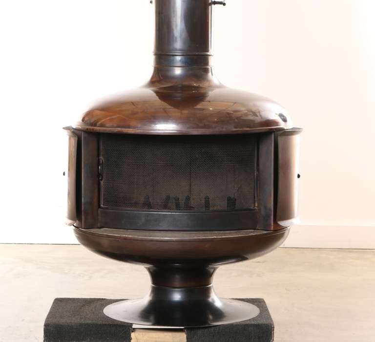 Designed by architect Gerald L. Jonas and manufactured by the Fire Drum Corporation in the 1970's this freestanding fireplace, built for lasting beauty and efficiency has stood the test of time. 
Featured in the 1971 Pasadena Art Museum California