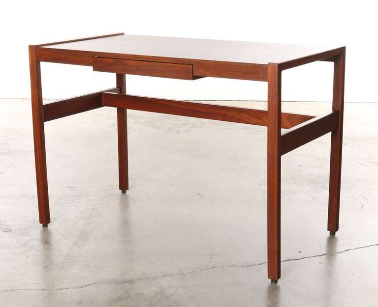 This design dates back to 1968 when Jens Risom created this desk for his own home in New Canaan Connecticut.
Designed as a small space writing solution.
The frame & legs are made of solid walnut with durable walnut laminate desk surface.

This