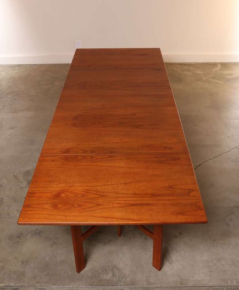 Long rectangular folding dining table in the style of Swedish designer Bruno Mathsson's Maria Table.

This Versatile table can be used as a drop leaf, gate leg, or fully extended in a rectangular shape. 

Adjusts into an amazing range of sizes