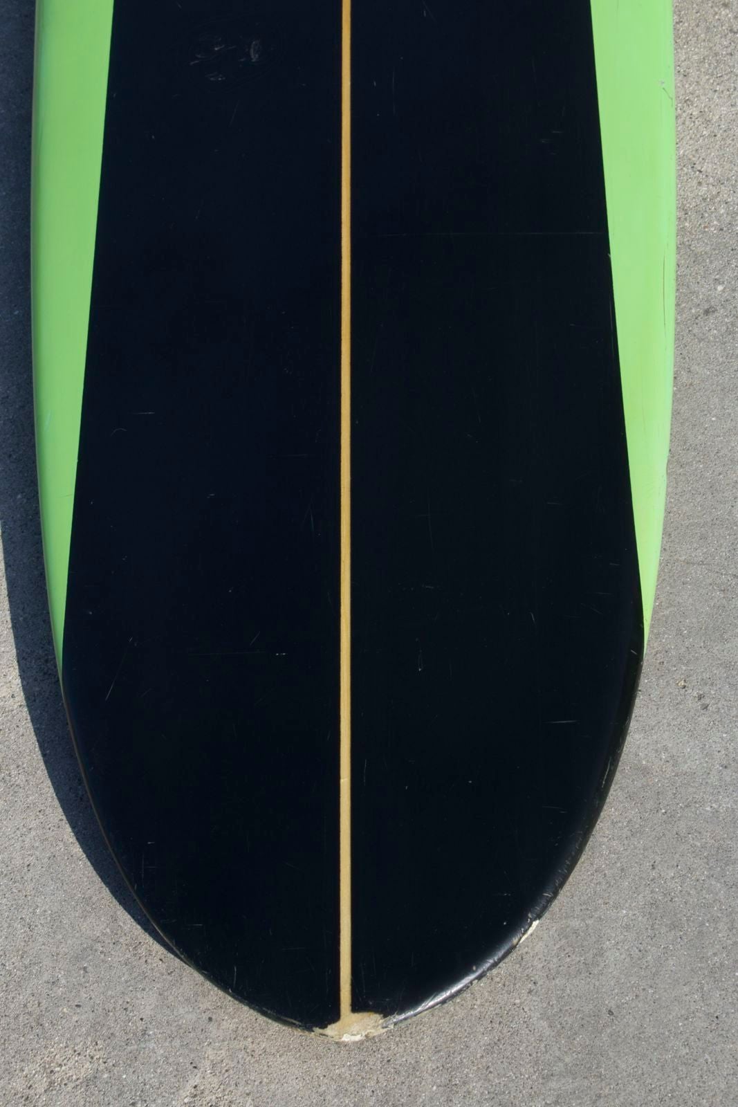 This majestic early 1960s Jack Haley Surfboard gives us visions of slow turns and long glides on a Classic California wave. The color scheme of black and green with a clear area on the deck around the logo make it a real eye catcher. 

From the