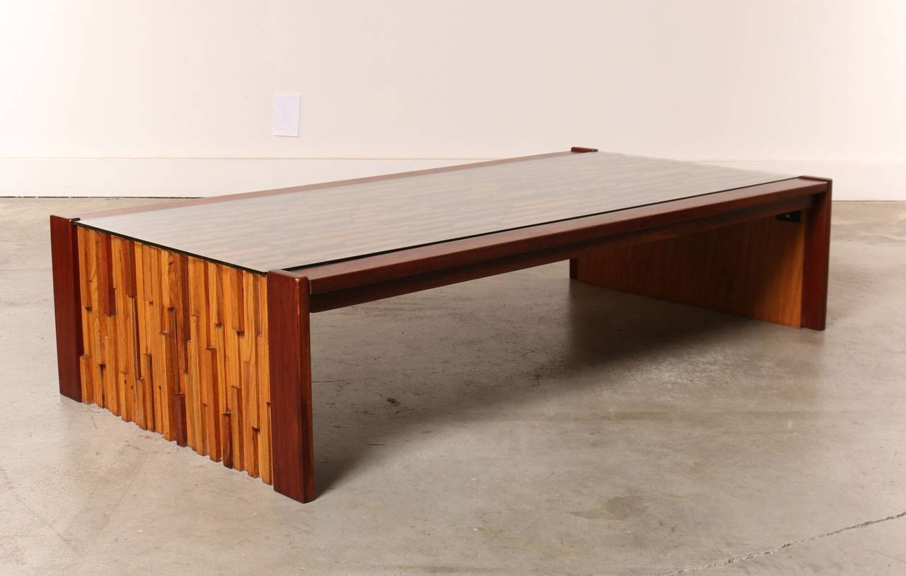 This is a great looking example of this iconic table. It is constructed of exotic woods such as rosewood, mahogany and Brazilian jacaranda. Woods are presented in irregular shades, so no two tables are identical. Fabulous condition constructed with