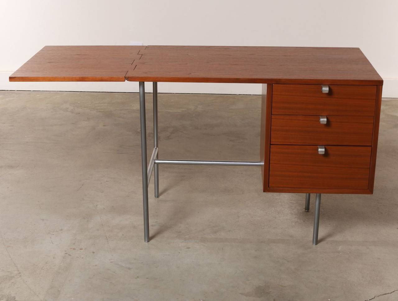 This desk packs a whole lot of style and tremendous functionality in a relatively compact space.  Sought after for it's quality and design, we're thrilled to offer this George Nelson Drop Leaf Desk Model 4754 in excellent original condition. 

The