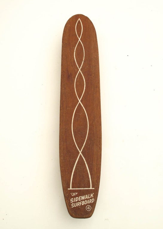 Rare long wooden Sidewalk Surfboard with early skate trucks and clay wheels.  Made from mahogany. By Nash