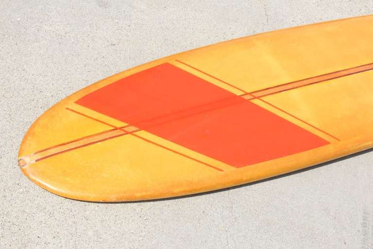 Natural 1960's beauty featuring great lines and a rich authentic patina in the colors of summer.
Made for riding big waves this longboard has two 1/4