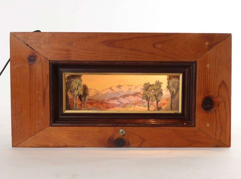 This Shadow Box Diorama features a three-dimensional hand painted plein air landscape painting accented by a California Mission, palm trees and desert landscape.  While it is a modest size of 10