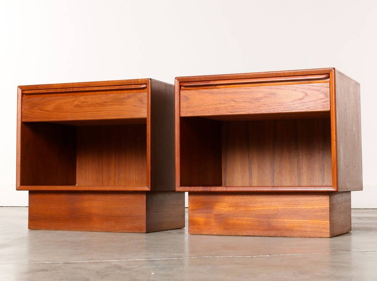 This pair of Mid-Century teak nightstands have wonderful clean lines, are extremely well made and are in very good condition. Sturdy construction, functional design with drawer and bottom shelf for storage and great looks make this set a bedside