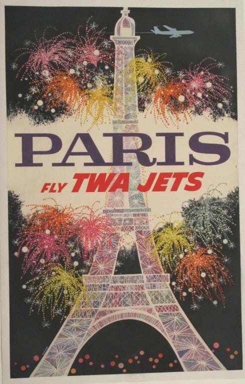 Wonderful image of a clear winter night in Paris. Fireworks are exploding around the Eiffel Tower as a TWA jet flies into the dark blue yonder.
You are sitting in a bistro on the Rive Gauche drinking chilled Chablis and eating a Plateau de Fruits