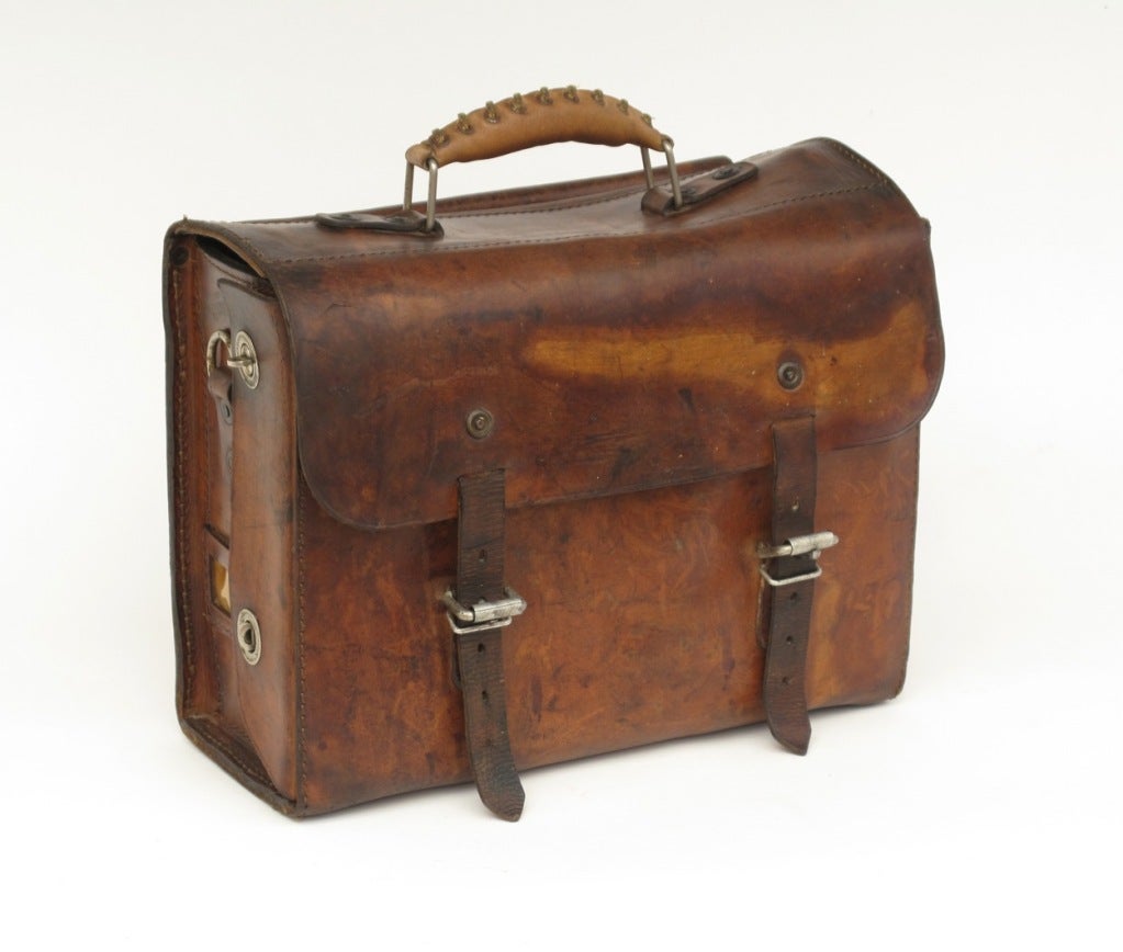 This case is as solid to use today as when it was produced.  Thick leather in excellent condition has exquisite outer patina, toned with years of use. Inside area is large enough to insert a laptop, books and drawing pads; tools or brushes have