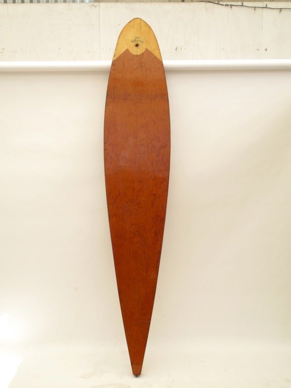 Beautiful handmade surfboard from the early 1940s.  Constructed like a canoe with a skeleton frame.  The deck and bottom is made of Marine Ply which is varnished.  The nose is painted a bright yellow with 