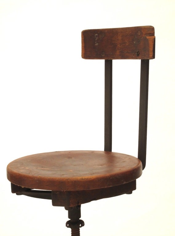 This set of three industrial stools have 360 degree rotating swivel seats. Practical in our modern age as well as being great looking, they raise and lower from counter height to bar height.  Beautiful patina on both metal and wood.