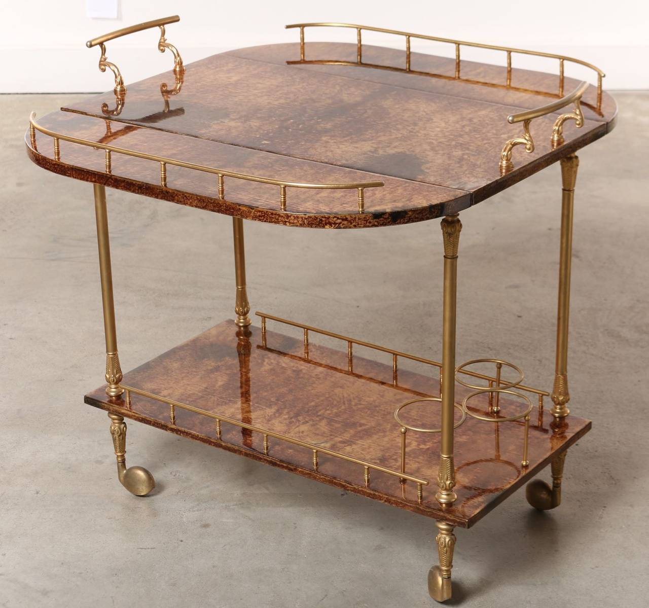 It's not surprising that this outstanding Mid-Century bar cart has its origins in 1950s Italy. Images of Sophia Loren and Carlo Ponti entertaining around this iconic piece spring to mind just looking at it. Ah, la dolce vita, the beautiful life.