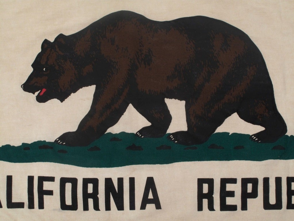 Beautiful old California flag from the 1940's. Wonderful color and patina make this a California keepsake with soul.

The bear, the star and the red band all retain their vibrancy. The white background has yellowed naturally with age. The classic