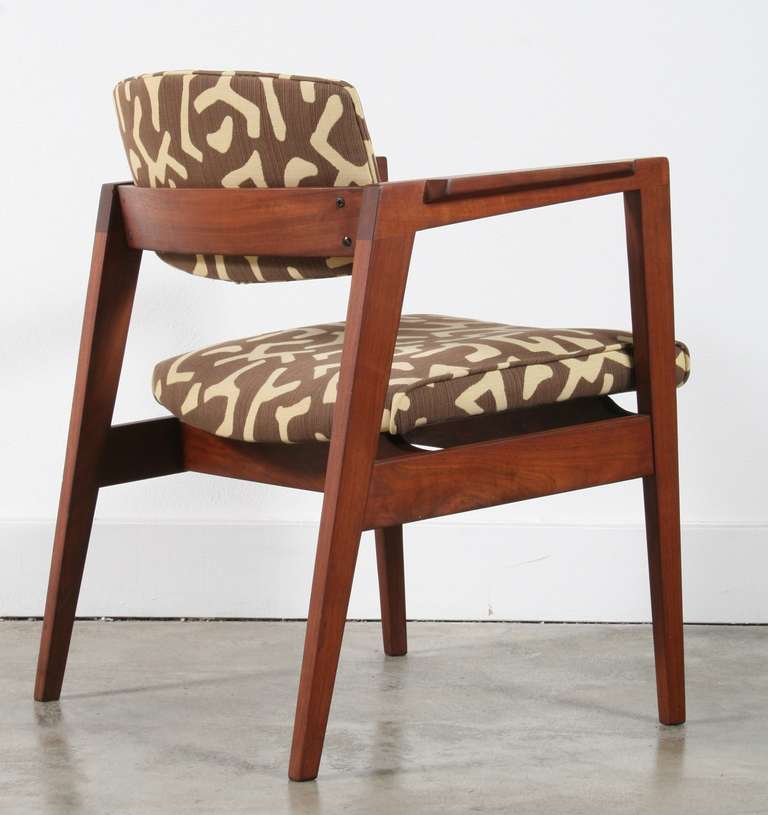 W.H. Gunlocke walnut chairs with sculpted armrests, floating seats and rounded backs. Very comfortable.