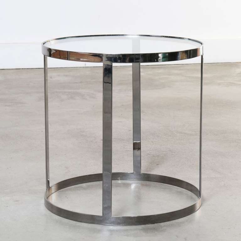 Elegant sculptural chrome and glass side / cocktail table designed by Milo Baughman circa 1970's.
Features a circular chrome base and top with four vertical chrome supports the glass top is removable.
Chrome exhibits light scratches, and areas of