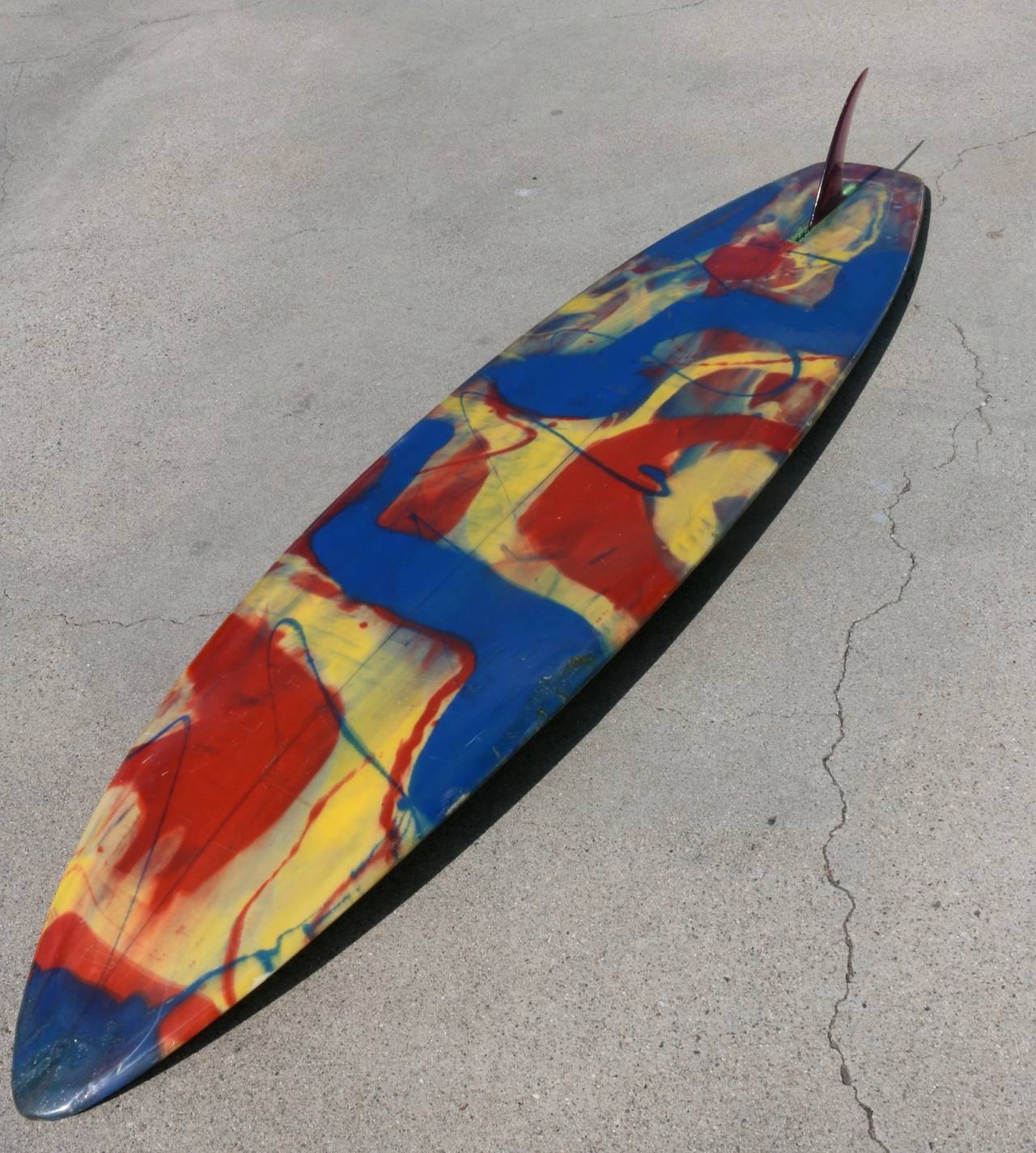 A kaleidoscope of color carving through the waves, that's what we think of when we look at this traditional Dewey Weber Ski Surfboard. Red and blue paint artistically splattered creating a decorative explosion on the bottom and wonderful accents on