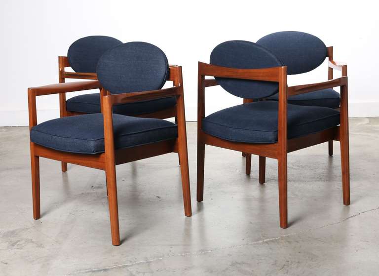 Set of four Jens Risom armchairs model # 1114  circa 1960's.
Solid walnut frames with elegant floating seats and oval backs.
Newly refinished and reupholstered in blue denim material.
A stellar example of Risom craftsmanship.

Recognized as a