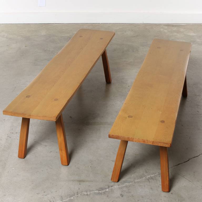 Mix the clarity of Paul McCobb's designs, sprinkle in a dash of Nakashima's wood working flair add a dollop of Ranch Oak's 1950's Americana - and you have these benches. 

Our eyes go to the free-form edge, dowels of alternating wood tone, solid
