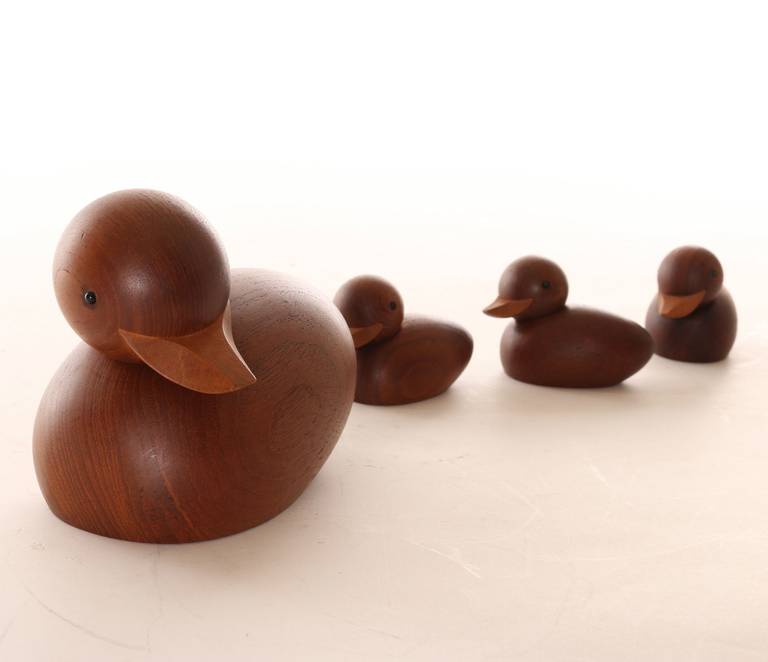 Adorable set of four danish modern little ducks. One momma duck and three ducklings by danish designers Hans Bolling and Skjode Skjern, circa 1960s, signed Skjode Denmark. These cleverly crafted ducks have heads held on with rubber allowing them to