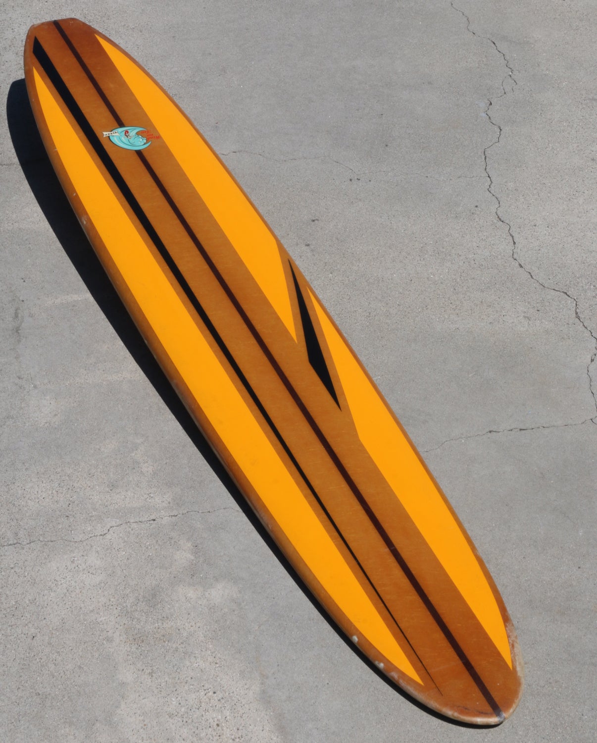 Gold Yellow Striped Titan Longboard Surfboard, All Original Circa 1960s
Vivid goldenrod yellow, accented by vertical and off-set black stripes.  Add to that the cleanest, most vibrant and vivid logo.  Great original condition. The sum of these is
