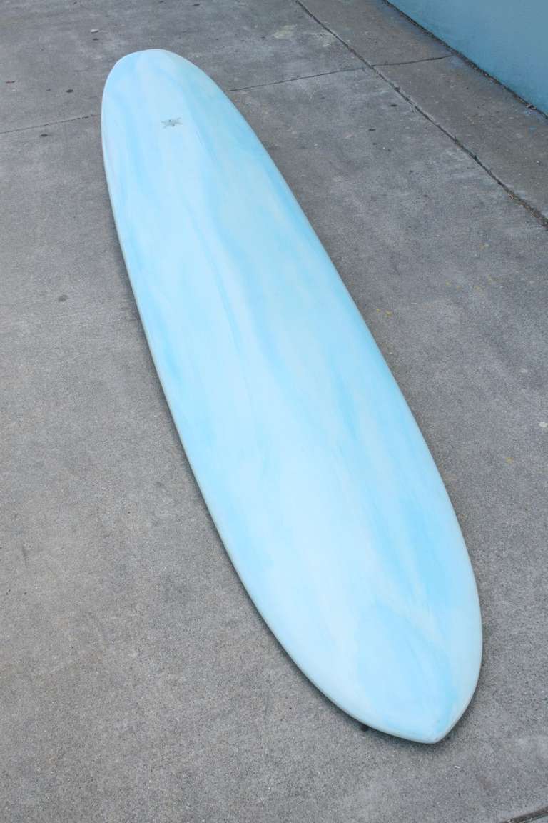 Made in Laguna Beach, California in the 1960s this Wardy Surfboard with acid splash design once belonged to a member of the Palos Verde Surf Club, one of the oldest surf clubs in California. According to our sources the 