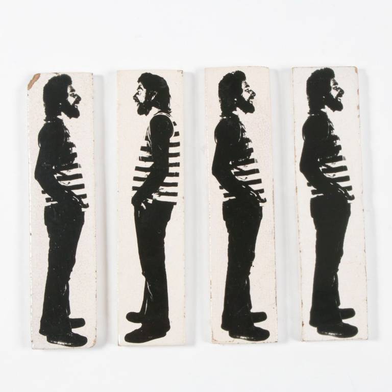 Four Glazed black and creamy white ceramic tiles with images of Stan Bitters silkscreened on the front. Stan made these 