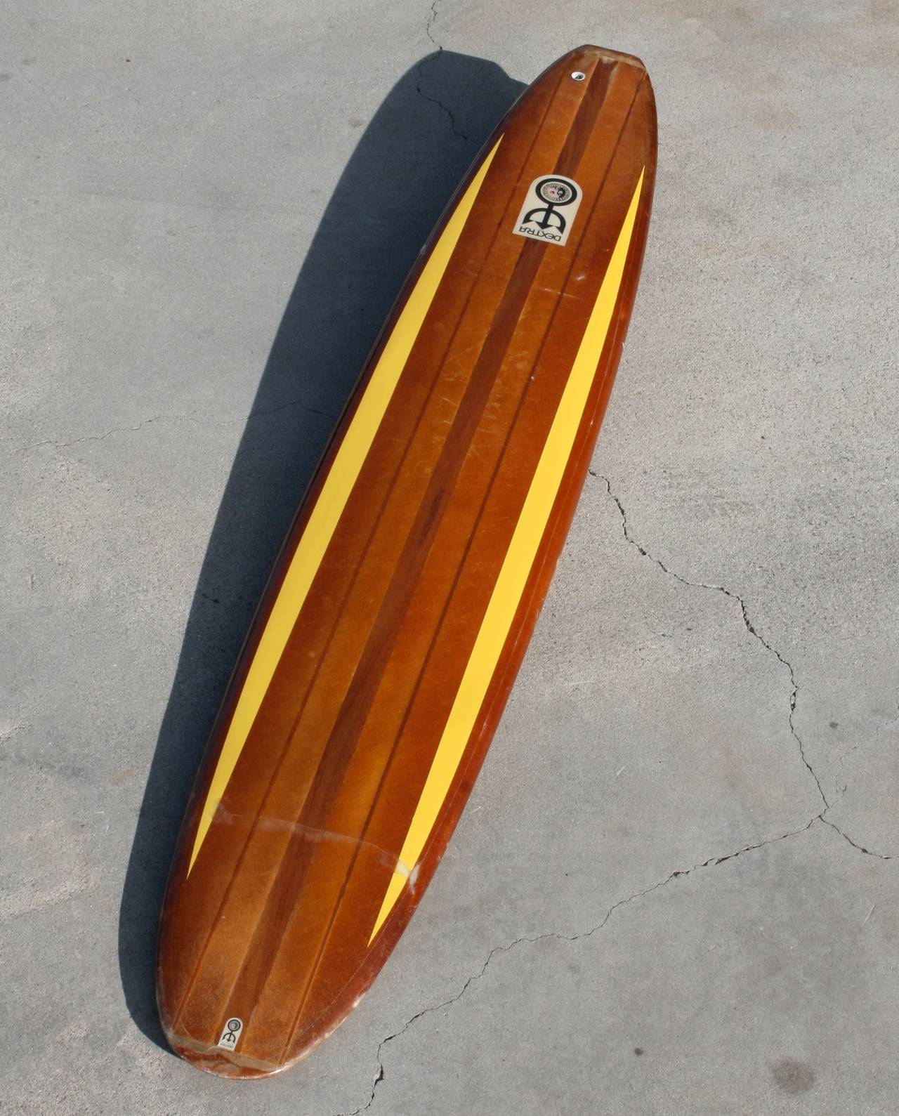 This 1960s Dextra surfboard is a true and glorious survivor: it carries some surf scars that have all been repaired, a patina only achieved with age and the presence and soul of its' creator.  The 2