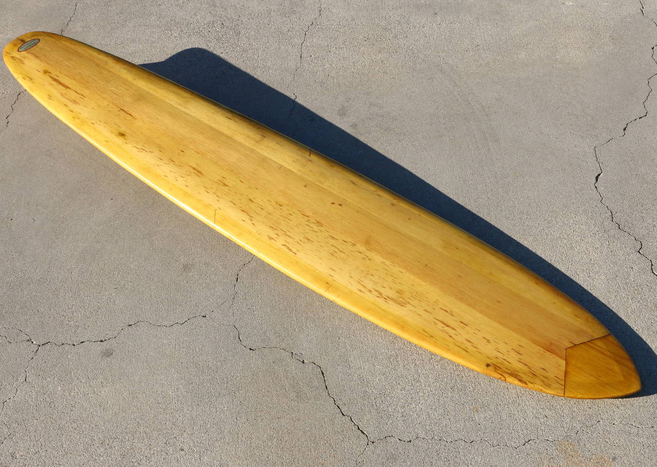 This rare and important fully restored solid balsa wood surfboard, classed as a 