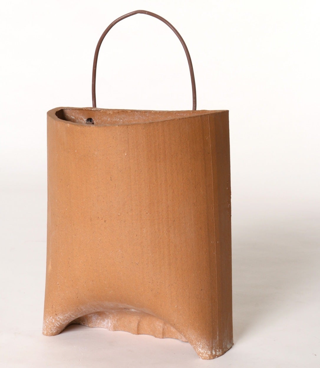 Wonderfully simple in aesthetic and form it's no surprise that this 1970s ceramic wall pocket with electrical wire cord is attributed to California ceramic artist Stan Bitters. As stylish as it is functional it makes the perfect container to grow
