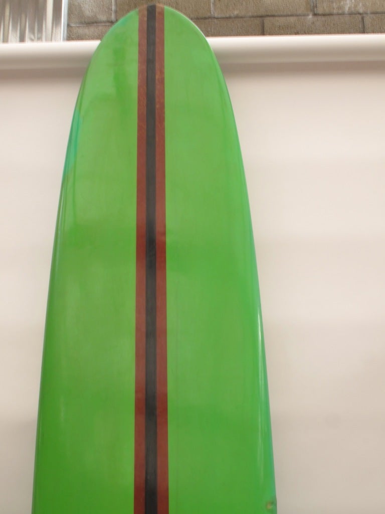 The Malibu Plastics Company had a short foray into surfboard manufacturing in the early 1960s.  Based in Malibu they were the first production surfboard company in city limits.  This board came in very limited colors, green being the most popular. 