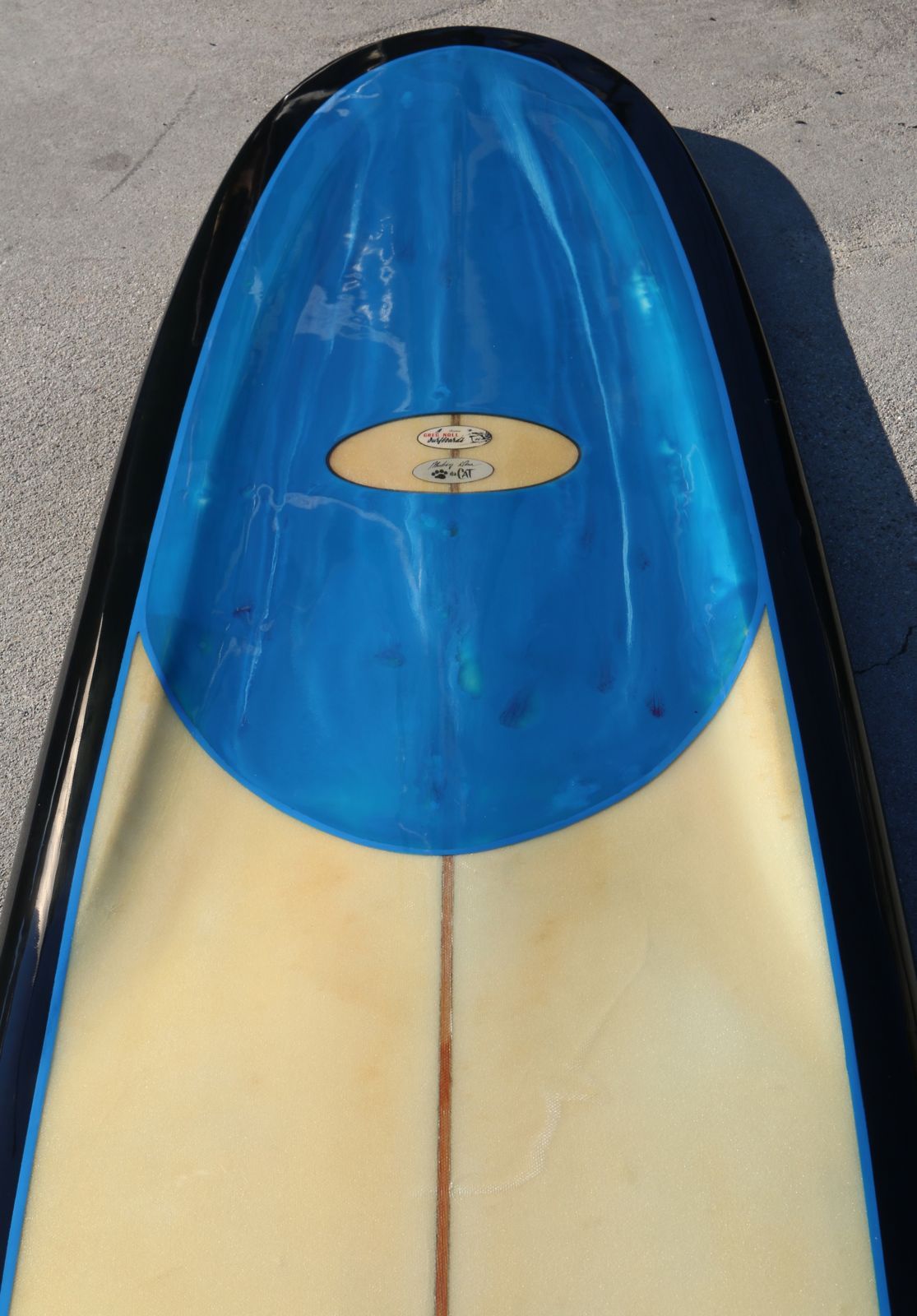 From the tip of it's scooped out nose to the bottom of It's pintail to its cut out cats eyes channels to its sexy black rails this 1965 Miki Dora 