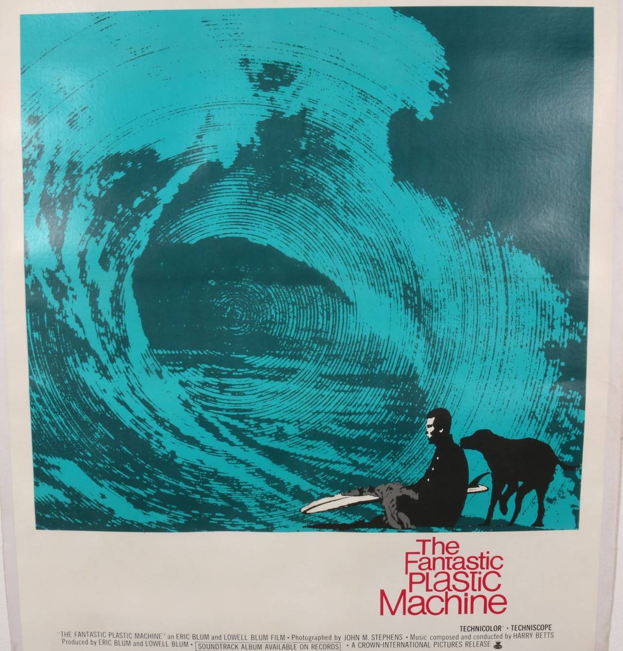 This crisp, clean and energetic graphic merges spy movie drama with surf movie vibe. Swirls of blue accented by black and white graphics reflective of the popular James Bond, Lee Marvin, Point Blank movie genre era. 

In this case the poster