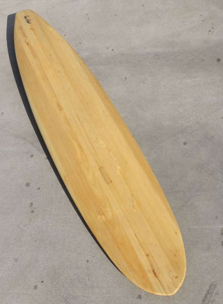 Hand shaped balsa gun surfboard made, ridden and restored by Pioneer surfer George Strempel.

During the late 1940s and early 1950s there was but a handful of West Coast surfers trying their hand at the powerful North Shore Hawaiian surf. George