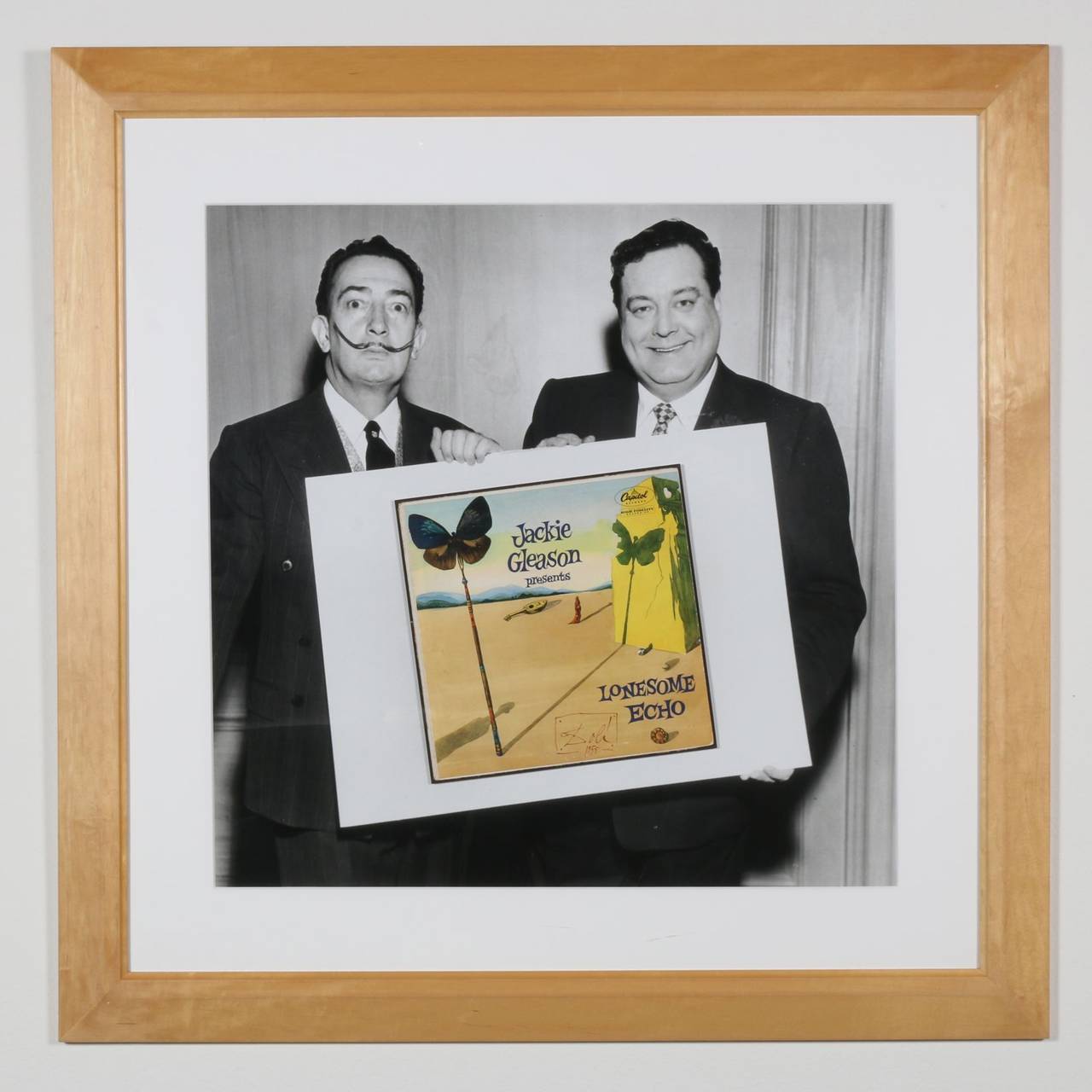 This is a super rare, all original, oversized black and white photograph. It features Jackie Gleason and Salvador Dali, celebrating the creation of Gleason's 1955 album with cover art by Dali. The 30