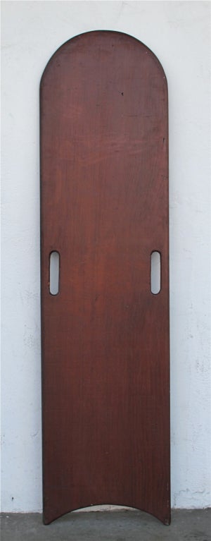 Handmade Paipo / Belly Board of solid wood construction.  Cut-out handles show natural wear from use.  Concave bottom was designed to fit body shape snugly while pushing off.  Rounded rails. Beautiful wood patina with alligator varnish.  A great