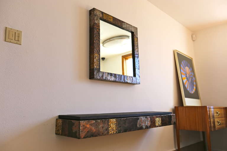 Brutal mirror and console by Paul Evans. Two sets available.

Mirror measures: 30