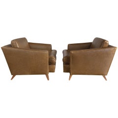 Pair of leather lounge chairs by J.WANAMAKER INC.