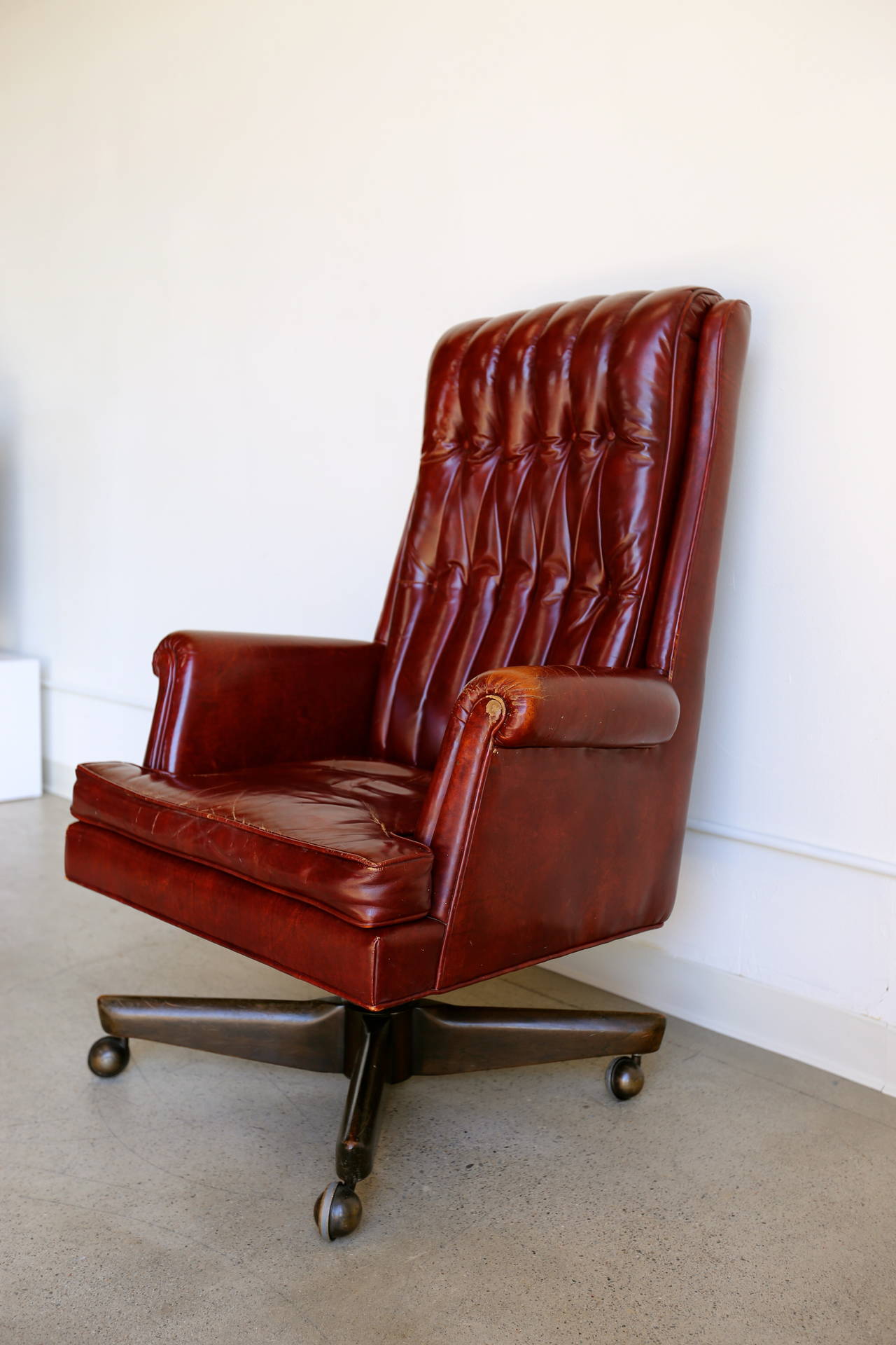 Distressed leather executive desk chair by Monteverdi-Young. This chair swivels and tilts.
