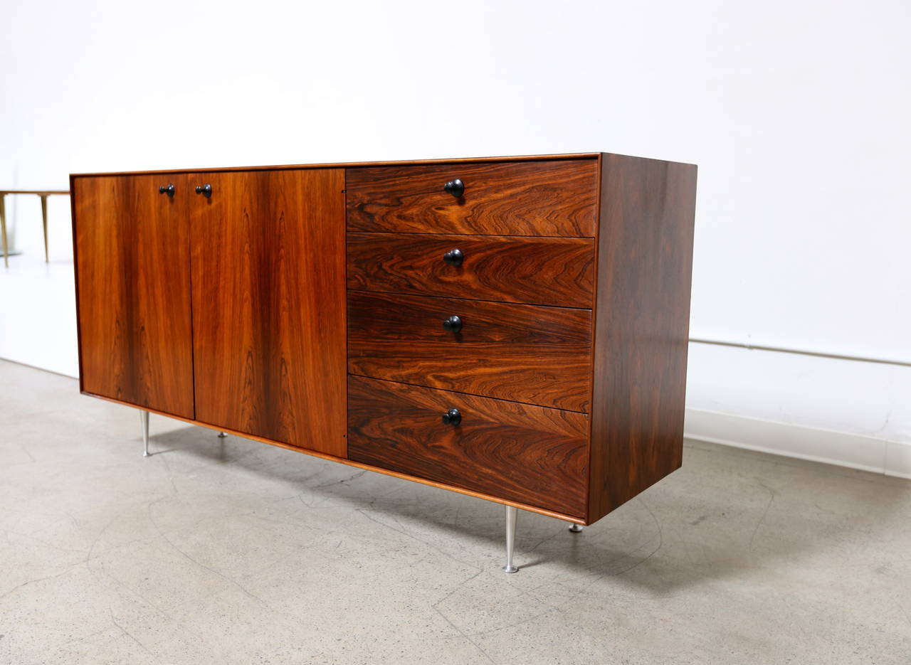 Rosewood thin edge credenza by George Nelson for Herman Miller. Dynamic rosewood grain inside and out.