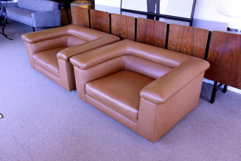 Pair of oversized brown leather lounge chairs by Edward Wormley for Dunbar.