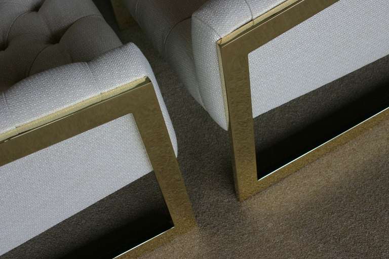 Pair of brass framed and tufted cantilevered lounge chairs by Milo Baughman 1