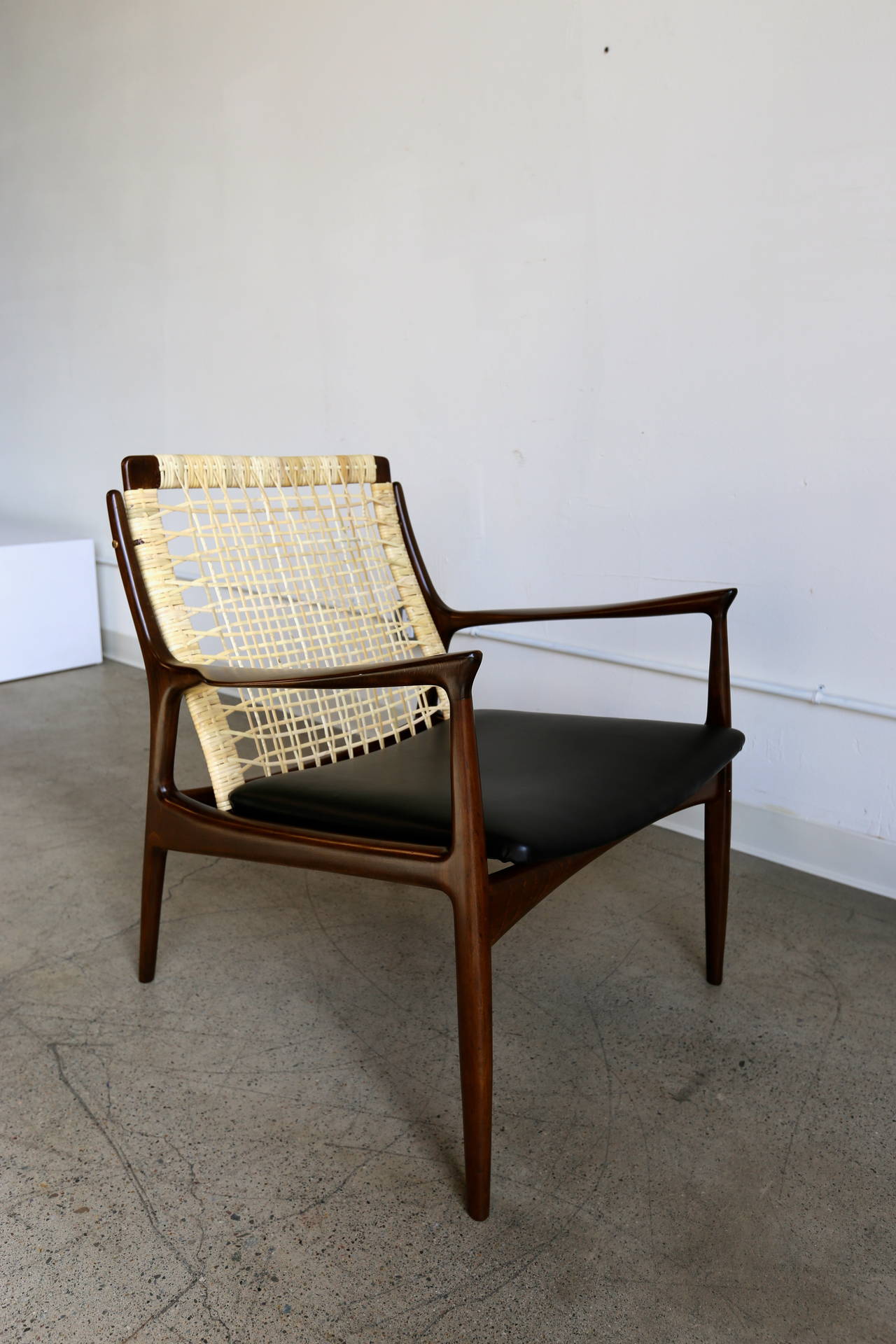 Caned lounge chair by Ib Kofod Larsen for Selig of Denmark.