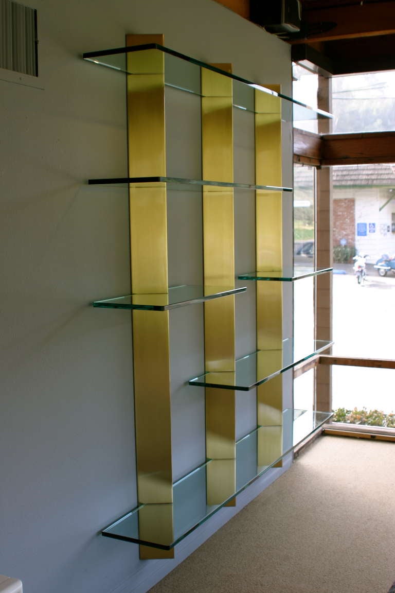 brass and glass wall shelves